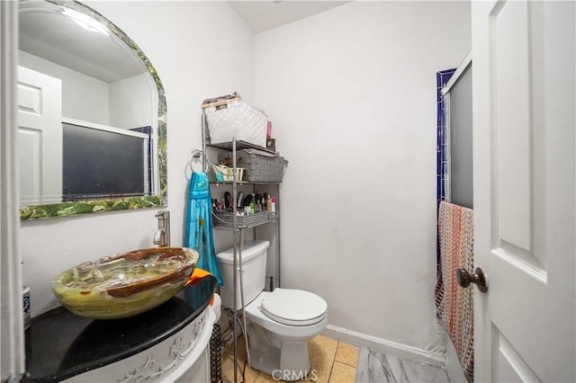 9051 Cedros Ave Unit 5, Panorama City, CA 91402 - bathroom with toilet, baseboards, tile patterned flooring, and vanity