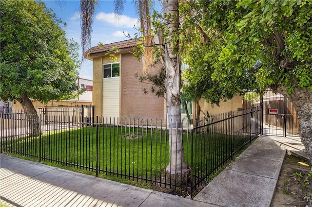 9051 Cedros Ave Unit 5, Panorama City, CA 91402 - view of home's exterior with brick siding and a gate