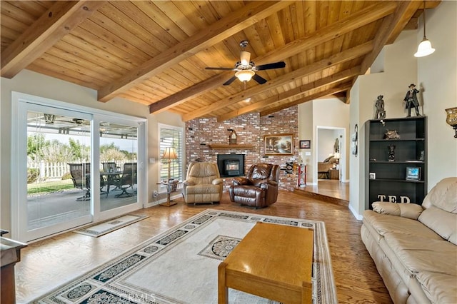 living area featuring wooden ceiling, wood finished floors, a ceiling fan, a fireplace, and baseboards
