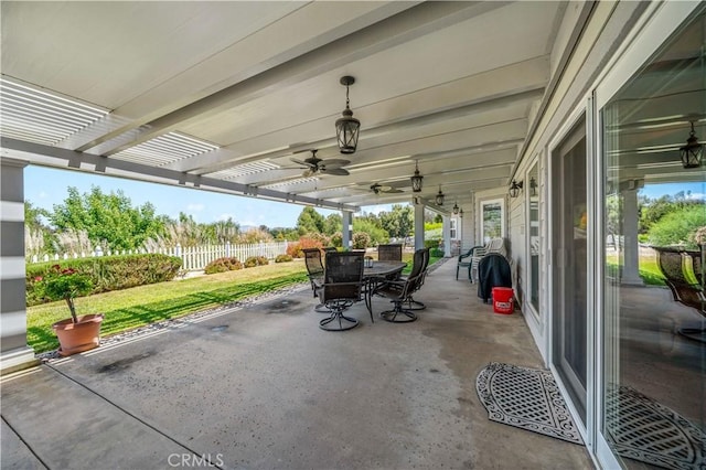view of patio / terrace featuring outdoor dining space, a pergola, a ceiling fan, and a water view