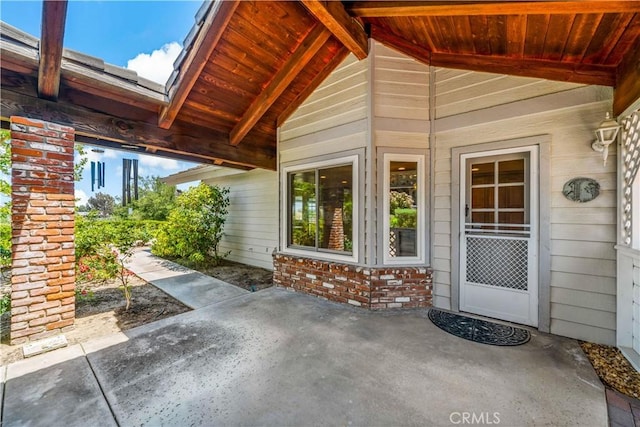 entrance to property featuring a patio
