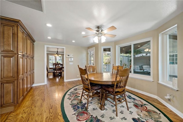 dining room featuring light wood finished floors, recessed lighting, ceiling fan, and baseboards