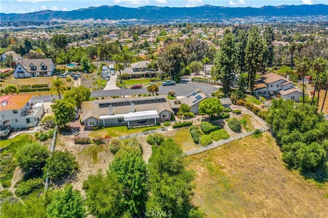 aerial perspective of suburban area with a mountainous background