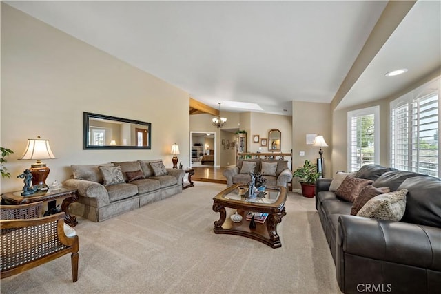 living room featuring carpet floors and a chandelier