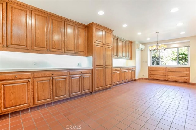 1558 Hillcrest Ave, Glendale, CA 91202 - kitchen featuring an AC wall unit, a chandelier, light tile patterned floors, brown cabinets, and recessed lighting