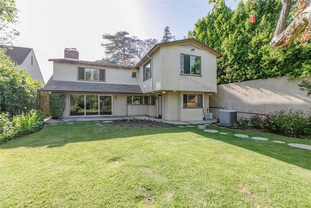 1558 Hillcrest Ave, Glendale, CA 91202 - rear view of house featuring a chimney, cooling unit, a lawn, and stucco siding