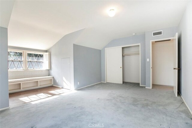 1558 Hillcrest Ave, Glendale, CA 91202 - unfurnished bedroom with vaulted ceiling, carpet, a closet, and baseboards