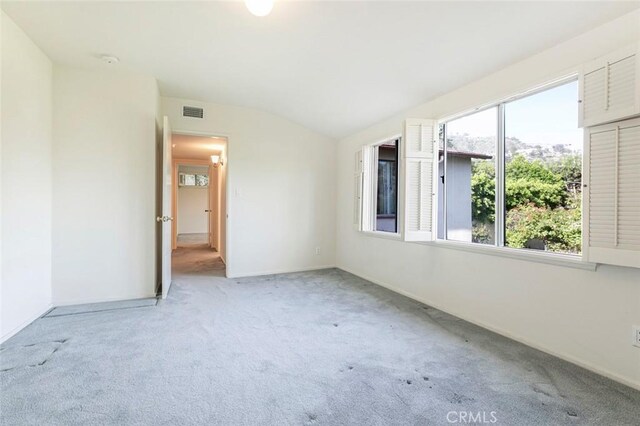 1558 Hillcrest Ave, Glendale, CA 91202 - spare room with light colored carpet, lofted ceiling, a smoke detector, and baseboards