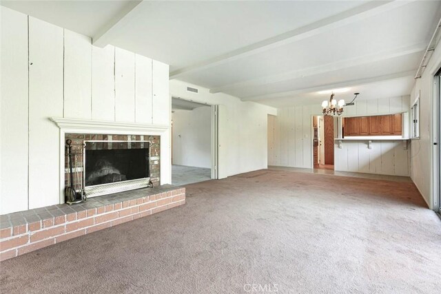 1558 Hillcrest Ave, Glendale, CA 91202 - unfurnished living room featuring a chandelier, light colored carpet, beamed ceiling, and a brick fireplace