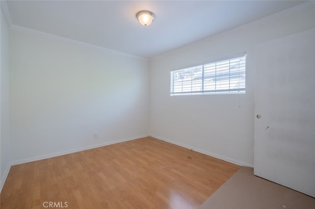 7857 Whitsett Ave, North Hollywood, CA 91605 - unfurnished room with light wood-style flooring, crown molding, and baseboards