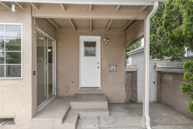 7857 Whitsett Ave, North Hollywood, CA 91605 - view of exterior entry featuring stucco siding and a patio