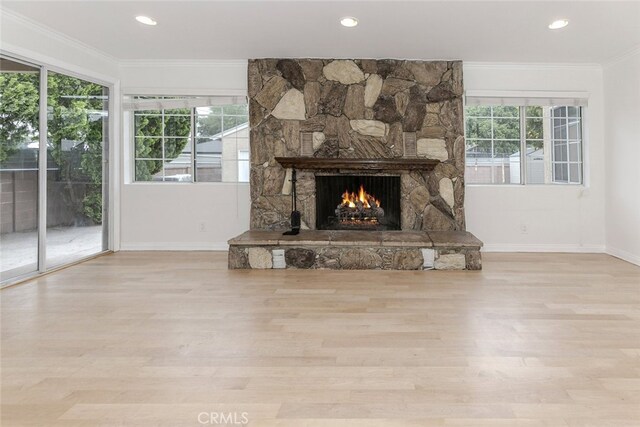 7857 Whitsett Ave, North Hollywood, CA 91605 - unfurnished living room with baseboards, a fireplace, ornamental molding, wood finished floors, and recessed lighting