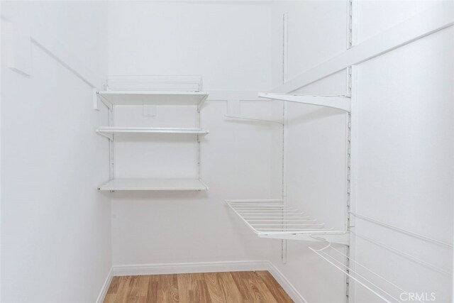 7857 Whitsett Ave, North Hollywood, CA 91605 - walk in closet featuring light wood finished floors