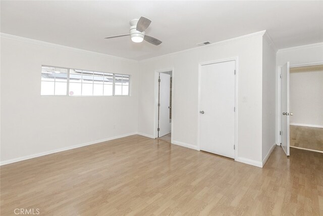 7857 Whitsett Ave, North Hollywood, CA 91605 - unfurnished bedroom featuring light wood-style flooring, ornamental molding, baseboards, and a ceiling fan