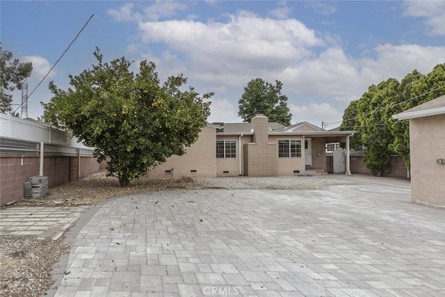 7857 Whitsett Ave, North Hollywood, CA 91605 - view of front of house with a chimney, stucco siding, and a patio