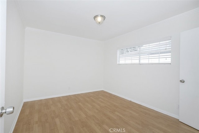 7857 Whitsett Ave, North Hollywood, CA 91605 - spare room with light wood finished floors, baseboards, and ornamental molding