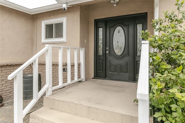 7857 Whitsett Ave, North Hollywood, CA 91605 - entrance to property featuring stucco siding and a surveillance system