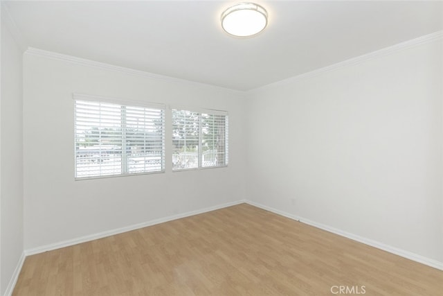 7857 Whitsett Ave, North Hollywood, CA 91605 - spare room with light wood-type flooring, ornamental molding, and baseboards