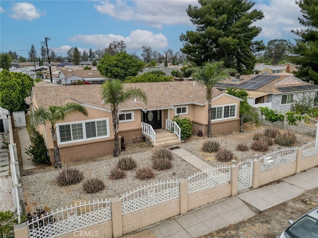 7857 Whitsett Ave, North Hollywood, CA 91605 - single story home featuring a gate, a fenced front yard, stucco siding, and a residential view