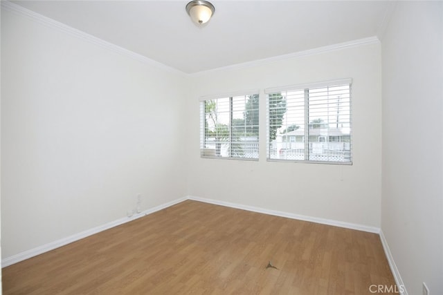 7857 Whitsett Ave, North Hollywood, CA 91605 - unfurnished room with light wood finished floors, baseboards, and crown molding