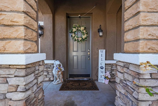 3035 Cat Tail Ct, Hemet, CA 92545 - doorway to property featuring stone siding and stucco siding