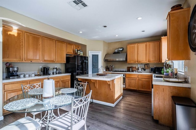 3035 Cat Tail Ct, Hemet, CA 92545 - kitchen featuring extractor fan, black appliances, dark wood finished floors, a center island, and recessed lighting