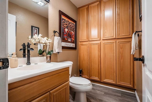 3035 Cat Tail Ct, Hemet, CA 92545 - bathroom featuring vanity, wood finished floors, and a textured wall