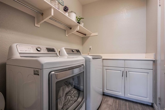 3035 Cat Tail Ct, Hemet, CA 92545 - washroom featuring independent washer and dryer, wood finished floors, and cabinet space