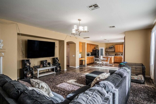 3035 Cat Tail Ct, Hemet, CA 92545 - living area with arched walkways, dark wood finished floors, and a chandelier