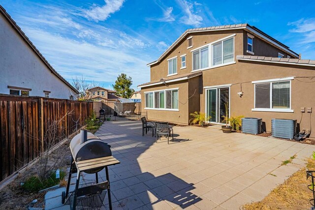 3035 Cat Tail Ct, Hemet, CA 92545 - back of property featuring stucco siding, a fenced backyard, and a patio area