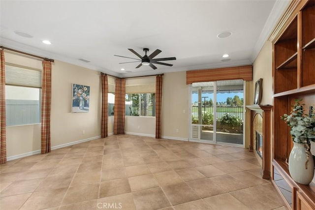 28399 Long Meadow Dr, Menifee, CA 92584 - unfurnished room featuring crown molding, ceiling fan, a glass covered fireplace, recessed lighting, and light tile patterned floors