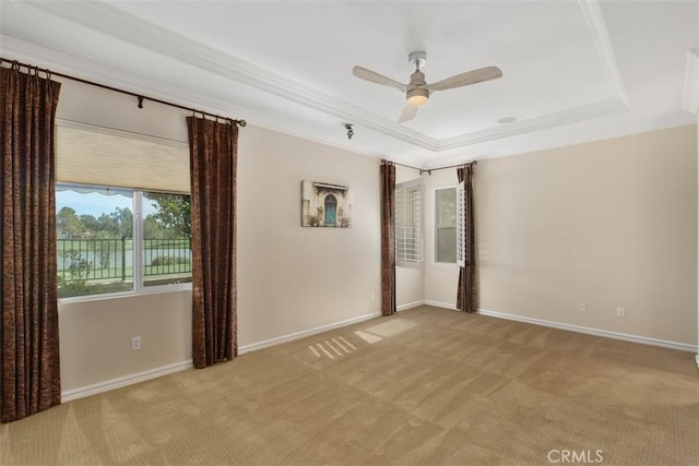 28399 Long Meadow Dr, Menifee, CA 92584 - empty room featuring crown molding, a tray ceiling, light colored carpet, and ceiling fan