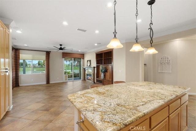 28399 Long Meadow Dr, Menifee, CA 92584 - kitchen with a ceiling fan, a center island, a glass covered fireplace, crown molding, and recessed lighting