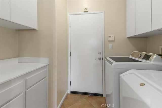 28399 Long Meadow Dr, Menifee, CA 92584 - laundry area with cabinet space, washer and dryer, and light tile patterned floors