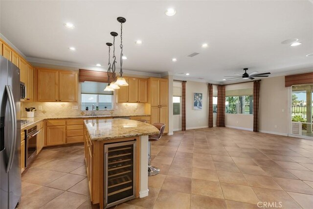 28399 Long Meadow Dr, Menifee, CA 92584 - kitchen featuring beverage cooler, tasteful backsplash, appliances with stainless steel finishes, a center island, and recessed lighting