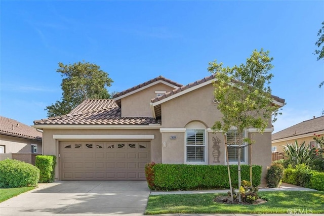 28399 Long Meadow Dr, Menifee, CA 92584 - mediterranean / spanish-style home with a garage, stucco siding, driveway, and a tile roof