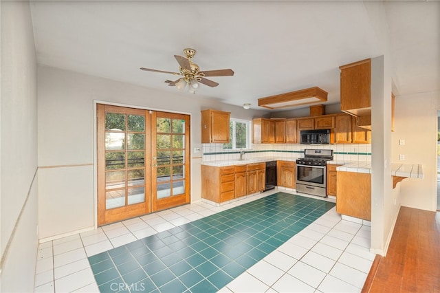 5664-5668 Clouds, Mariposa, CA 95338 - kitchen with black appliances, tile counters, decorative backsplash, brown cabinets, and ceiling fan