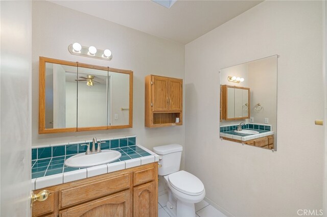 5664-5668 Clouds, Mariposa, CA 95338 - bathroom with toilet, a ceiling fan, tile patterned flooring, and vanity