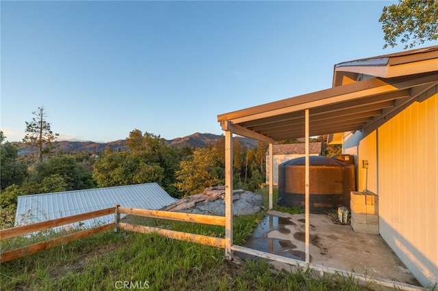 5664-5668 Clouds, Mariposa, CA 95338 - view of yard featuring fence, a storage shed, an outbuilding, oil tank, and a mountain view