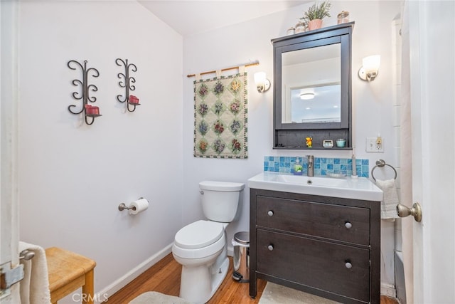 5664-5668 Clouds, Mariposa, CA 95338 - bathroom with wood finished floors, toilet, backsplash, vanity, and baseboards