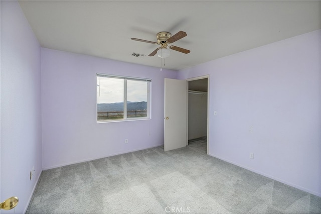5664-5668 Clouds, Mariposa, CA 95338 - unfurnished bedroom featuring carpet flooring, ceiling fan, and a walk in closet