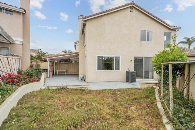 8580 New Salem St Unit 7, San Diego, CA 92126 - back of property featuring a patio, central AC, stucco siding, a fenced backyard, and a tiled roof