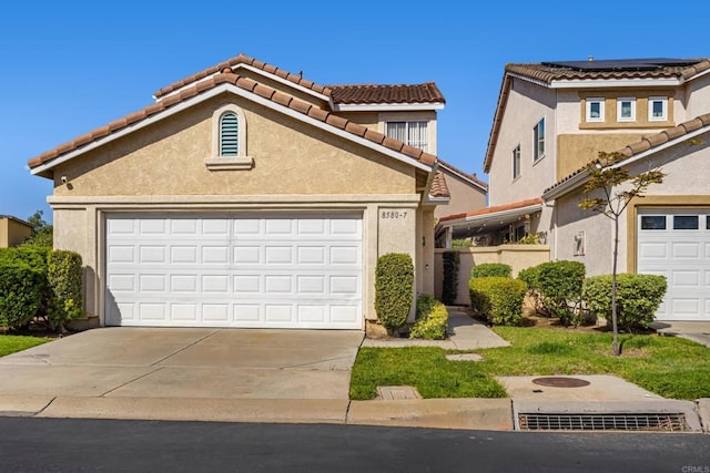 8580 New Salem St Unit 7, San Diego, CA 92126 - view of front of property with a tile roof, driveway, stucco siding, and a garage