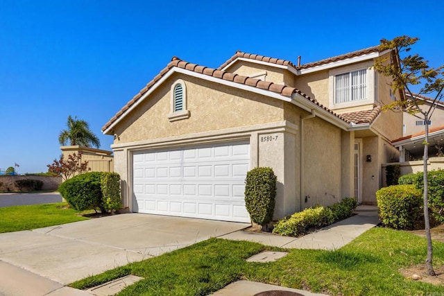 8580 New Salem St Unit 7, San Diego, CA 92126 - view of front of property with stucco siding, a tile roof, driveway, and an attached garage