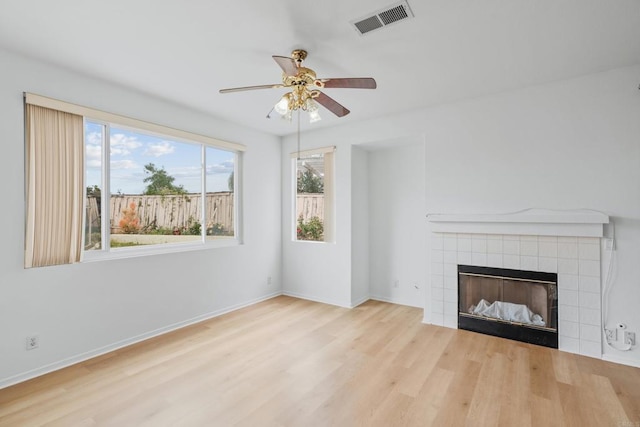 8580 New Salem St Unit 7, San Diego, CA 92126 - unfurnished living room featuring wood finished floors, ceiling fan, a fireplace, and baseboards