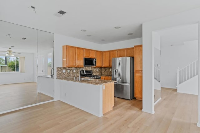 8580 New Salem St Unit 7, San Diego, CA 92126 - kitchen with appliances with stainless steel finishes, light wood finished floors, a peninsula, and ceiling fan