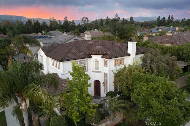 26 Upland, Irvine, CA 92602 - view of front of property with stucco siding, a tile roof, and a chimney
