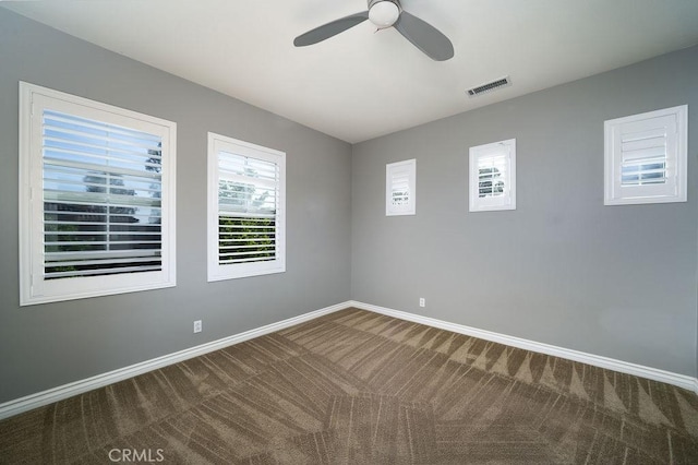 26 Upland, Irvine, CA 92602 - spare room featuring plenty of natural light, carpet floors, a ceiling fan, and baseboards