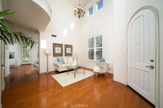 26 Upland, Irvine, CA 92602 - entryway with wood finished floors, a chandelier, a high ceiling, and baseboards
