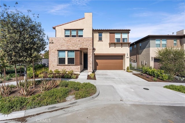 920 Bunkhouse Dr, Rancho Mission Viejo, CA 92694 - view of front of property featuring concrete driveway, a garage, and stucco siding